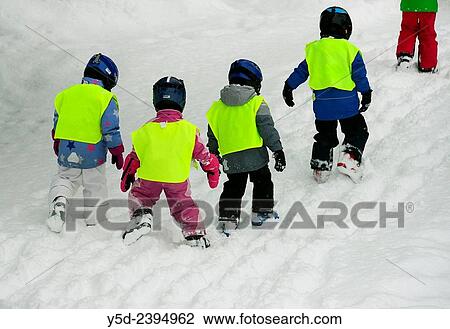 very small kids - 3-4 years old coming back to hotel after first lessons of skiing, Saas-Fee, Valais, Switzerland. View Large Photo Image Stock Image - very small kids - 3-4 years old coming back to hotel after first lessons of skiing, Saas-Fee, Valais, Switzerland.. Fotosearch