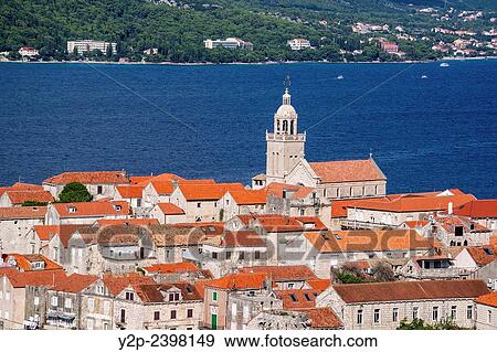 Stock Photo - View of historical center of Korcula town with dominating belfry of St. Mark Cathedral. Croatia.. Fotosearch