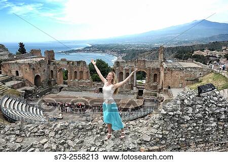 Woman at the Greek amphitheatre, Taormina, Sicily, Italy View Large Photo Image Stock Image - Woman at the Greek amphitheatre, Taormina, Sicily, Italy. Fotosearch