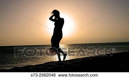 Woman in the beach during the sunset, Cabo de Gata, AlmerÃa, AndalucÃa, Spain, Europe View Large Photo Image Stock Photograph - Woman in the beach during the sunset, Cabo de Gata, AlmerÃa, AndalucÃa, Spain, Europe. Fotosearch