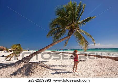 Woman posing on the beach, Tulum, Quintana Roo, Yucatan Province, Mexico, North America. View Large Photo Image Stock Image - Woman posing on the beach, Tulum, Quintana Roo, Yucatan Province, Mexico, North America.. Fotosearch