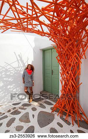 Woman posing with an orange scarf near a whitewashed house in town center, Mykonos, Cyclades Islands, Greek Islands, Greece, Europe. View Large Photo Image Stock Photograph - Woman posing with an orange scarf near a whitewashed house in town center, Mykonos, Cyclades Islands, Greek Islands, Greece, Europe.. Fotosearch