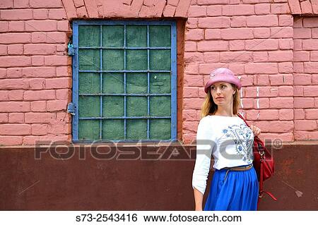 Stock Photograph - Woman walking in a Kazan street, Tatarstan, Russia. Fotosearch