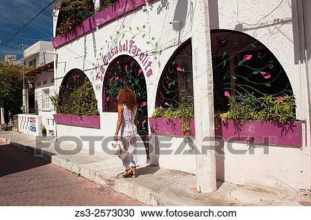 Woman walking in the street of town center, Isla Mujeres, Quintana Roo, Yucatan Province, Mexico, Central America. View Large Photo Image Stock Image - Woman walking in the street of town center, Isla Mujeres, Quintana Roo, Yucatan Province, Mexico, Central America.. Fotosearch