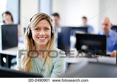 Stock Image - Woman with headphones and microphone. Computer Academy.. Fotosearch