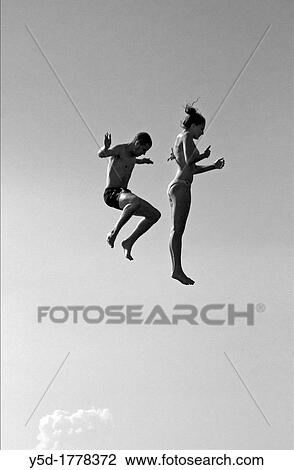 young couple jumping from the jumping tower to water, beach on the Geneva Lake in Geneva called ´Paquis plage´, Geneva, Switzerland View Large Photo Image Stock Image - young couple jumping from the jumping tower to water, beach on the Geneva Lake in Geneva called ´Paquis plage´, Geneva, Switzerland. Fotosearch