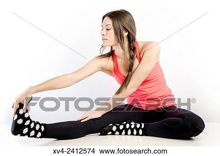 Picture - Young Woman doing Fitness in her home.. Fotosearch