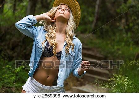 Young woman in park provocative exposed bra. View Large Photo Image Stock Photograph - Young woman in park provocative exposed bra.. Fotosearch
