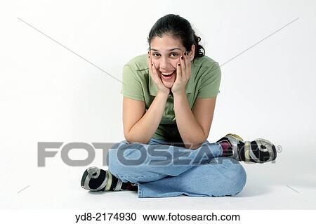 Stock Image - Young woman posing in the Studio. Fotosearch