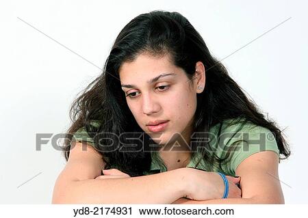 Stock Image - Young woman posing in the Studio. Fotosearch