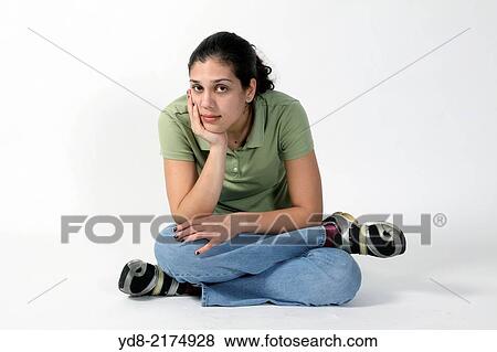 Stock Photo - Young woman posing in the Studio. Fotosearch