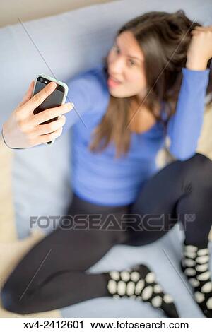 Stock Image - Young Woman selfie.. Fotosearch