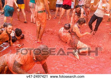 150 tons of tomatoes serve as ammunition for traditional Tomatina, a battle which attracted this year more than 22, 000 people of 96 different nationalities to launch a record number tomatoes. Buñol, Valencia province, Spain. View Large Photo Image Stock Image - 150 tons of tomatoes serve as ammunition for traditional Tomatina, a battle which attracted this year more than 22, 000 people of 96 different nationalities to launch a record number tomatoes. Buñol, Valencia province, Spain.. Fotosearch