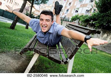 18 year old man in a garden, barcelona, Spain, Europe. View Large Photo Image Stock Photograph - 18 year old man in a garden, barcelona, Spain, Europe.. Fotosearch