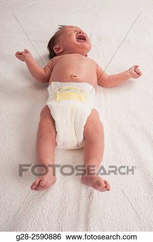 2 weeks old baby in his diaper at the clinic, View Large Photo Image Stock Photograph - 2 weeks old baby in his diaper at the clinic,. Fotosearch
