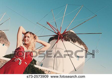 30 year old woman in front of windmill, Mykonos, Cyclades islands, Greece View Large Photo Image Stock Photo - 30 year old woman in front of windmill, Mykonos, Cyclades islands, Greece. Fotosearch