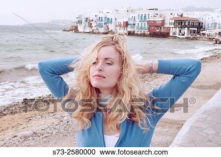 30 years old woman in Little Venice, Mykonos, Cyclades Islands, Greece View Large Photo Image Stock Image - 30 years old woman in Little Venice, Mykonos, Cyclades Islands, Greece. Fotosearch
