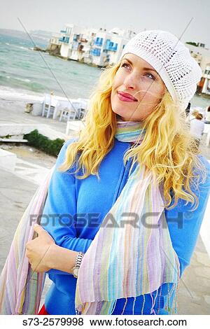 Stock Photo - 30 years old woman in Little Venice, Mykonos, Cyclades Islands, Greece. Fotosearch