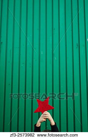 6 years old boy holding a red star. View Large Photo Image Stock Image - 6 years old boy holding a red star.. Fotosearch