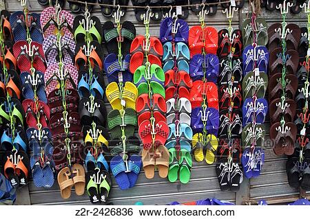 Stock Photograph - A Bangladeshi street vendor wait for customers in front of a closed shop during a nationwide strike called by the opposition Bangladesh Nationalist Party (BNP) in Dhaka on October 27, 2013. Three people were killed in nationwide clashes as Bangladesh's op. Fotosearch