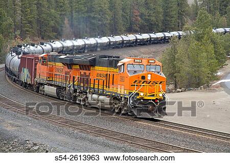Stock Image - A BNSF tank train hauling oil at Scribner, Marshall, Washington, USA.. Fotosearch