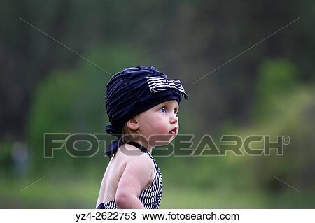 A female toddler in a swimming suit at Fish Lake, Spokane, Washington, USA. View Large Photo Image Stock Image - A female toddler in a swimming suit at Fish Lake, Spokane, Washington, USA.. Fotosearch