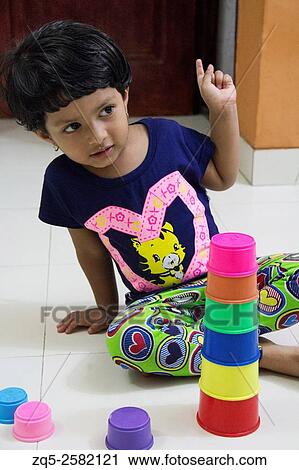 A kid playing with toys, Pune, India. View Large Photo Image Stock Image - A kid playing with toys, Pune, India.. Fotosearch