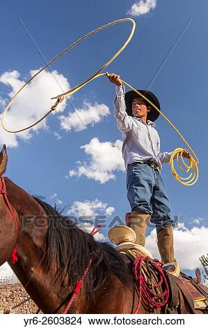 A Mexican charro or cowboy practices roping skills on his horse before a Charreada competition at a hacienda ranch in Alcocer, Mexico. View Large Photo Image Picture - A Mexican charro or cowboy practices roping skills on his horse before a Charreada competition at a hacienda ranch in Alcocer, Mexico.. Fotosearch