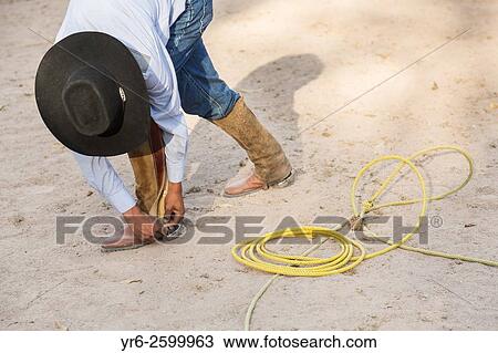 A Mexican charro or cowboy practices roping skills on his horse before a Charreada competition at a hacienda ranch in Alcocer, Mexico. View Large Photo Image Stock Image - A Mexican charro or cowboy practices roping skills on his horse before a Charreada competition at a hacienda ranch in Alcocer, Mexico.. Fotosearch