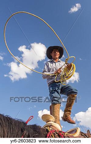 A Mexican charro or cowboy practices roping skills on his horse before a Charreada competition at a hacienda ranch in Alcocer, Mexico. View Large Photo Image Stock Image - A Mexican charro or cowboy practices roping skills on his horse before a Charreada competition at a hacienda ranch in Alcocer, Mexico.. Fotosearch