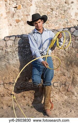 A Mexican charro or cowboy practices roping skills on his horse before a Charreada competition at a hacienda ranch in Alcocer, Mexico. View Large Photo Image Stock Image - A Mexican charro or cowboy practices roping skills on his horse before a Charreada competition at a hacienda ranch in Alcocer, Mexico.. Fotosearch