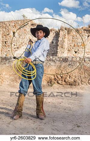 A Mexican charro or cowboy practices roping skills on his horse before a Charreada competition at a hacienda ranch in Alcocer, Mexico. View Large Photo Image Stock Photo - A Mexican charro or cowboy practices roping skills on his horse before a Charreada competition at a hacienda ranch in Alcocer, Mexico.. Fotosearch