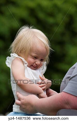 A mother and her toddler daughter outdoors. View Large Photo Image Stock Photograph - A mother and her toddler daughter outdoors.. Fotosearch