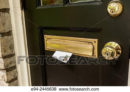 A stamped envelope in a mail slot on a door for the mailman to pickup. Pittsburgh Pennsylvania USA View Large Photo Image Stock Photo - A stamped envelope in a mail slot on a door for the mailman to pickup. Pittsburgh Pennsylvania USA. Fotosearch