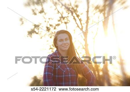 A teen girl outdoors at sunset. View Large Photo Image Stock Image - A teen girl outdoors at sunset.. Fotosearch