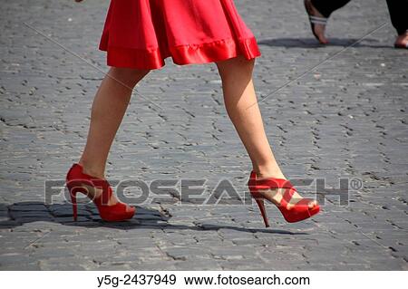 A woman with red dress and shoes walking in piazza del popolo square in Rome Italy View Large Photo Image Stock Photo - A woman with red dress and shoes walking in piazza del popolo square in Rome Italy. Fotosearch