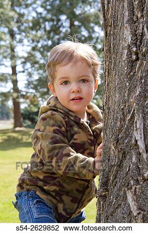 A young boy plays at a park in Pullman, Washington, USA. View Large Photo Image Stock Image - A young boy plays at a park in Pullman, Washington, USA.. Fotosearch