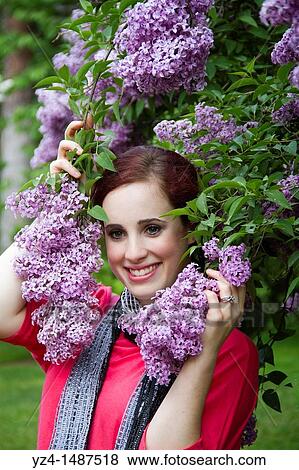 A young woman with lilacs in Spokane, Washington, USA. View Large Photo Image Stock Photo - A young woman with lilacs in Spokane, Washington, USA.. Fotosearch