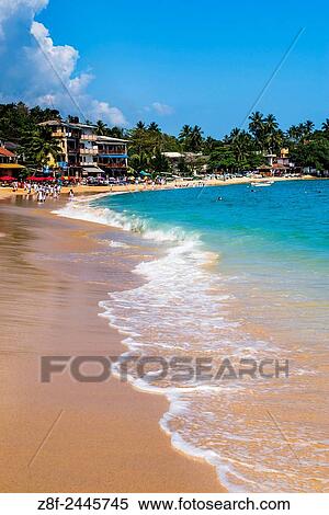 Stock Photography - Accommodation on Unawatuna Beach, a sandy beach on the South Coast of Sri Lanka, Asia.. Fotosearch
