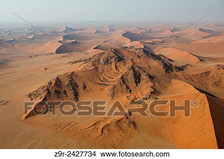 Aerial view of the dunes of the Namib Naukluft, the oldest desert in the world. Namibia. View Large Photo Image Picture - Aerial view of the dunes of the Namib Naukluft, the oldest desert in the world. Namibia.. Fotosearch