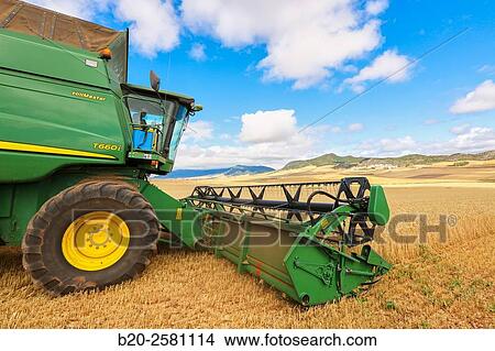 Agricultural machinery Combine harvester on field of wheat? Learza? estate Near Estella, Navarre, Spain View Large Photo Image Picture - Agricultural machinery Combine harvester on field of wheat? Learza? estate Near Estella, Navarre, Spain. Fotosearch