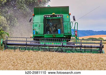 Agricultural machinery Combine harvester on field of wheat? Learza? estate Near Estella, Navarre, Spain View Large Photo Image Stock Image - Agricultural machinery Combine harvester on field of wheat? Learza? estate Near Estella, Navarre, Spain. Fotosearch