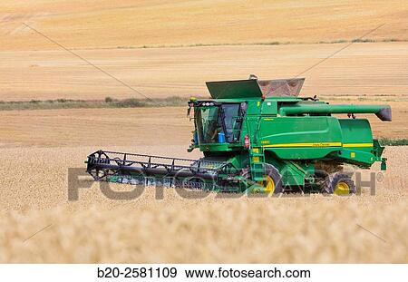 Agricultural machinery Combine harvester on field of wheat? Learza? estate Near Estella, Navarre, Spain View Large Photo Image Stock Photo - Agricultural machinery Combine harvester on field of wheat? Learza? estate Near Estella, Navarre, Spain. Fotosearch