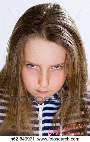 Angry little girl who looks towards the camera View Large Photo Image Stock Image - Angry little girl who looks towards the camera. Fotosearch