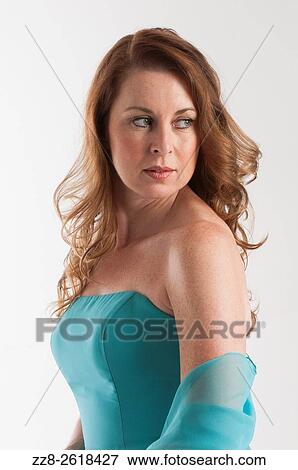 Attractive mature woman looking over shoulder. View Large Photo Image Stock Photo - Attractive mature woman looking over shoulder.. Fotosearch