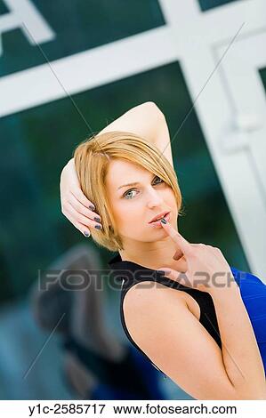 Attractive woman portrait finger on mouth View Large Photo Image Stock Photo - Attractive woman portrait finger on mouth. Fotosearch