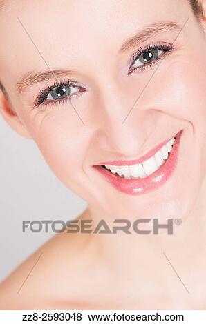 Attractive young woman smiling. View Large Photo Image Stock Photo - Attractive young woman smiling.. Fotosearch