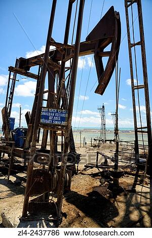 Azerbaijan, Baku, Bibi Heybat, nodding donkey oil pumps pumping oil up from an oil field. View Large Photo Image Stock Photograph - Azerbaijan, Baku, Bibi Heybat, nodding donkey oil pumps pumping oil up from an oil field.. Fotosearch