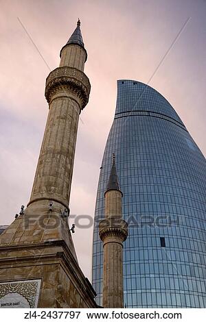 Stock Photo - Azerbaijan, Baku, Martyrs? Lane (Alley of Martyrs), small mosque and the Flame Towers.. Fotosearch