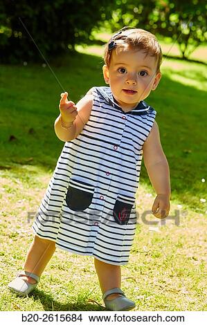Baby playing in the park. Getaria. Gipuzkoa. Basque Country. Spain View Large Photo Image Picture - Baby playing in the park. Getaria. Gipuzkoa. Basque Country. Spain. Fotosearch